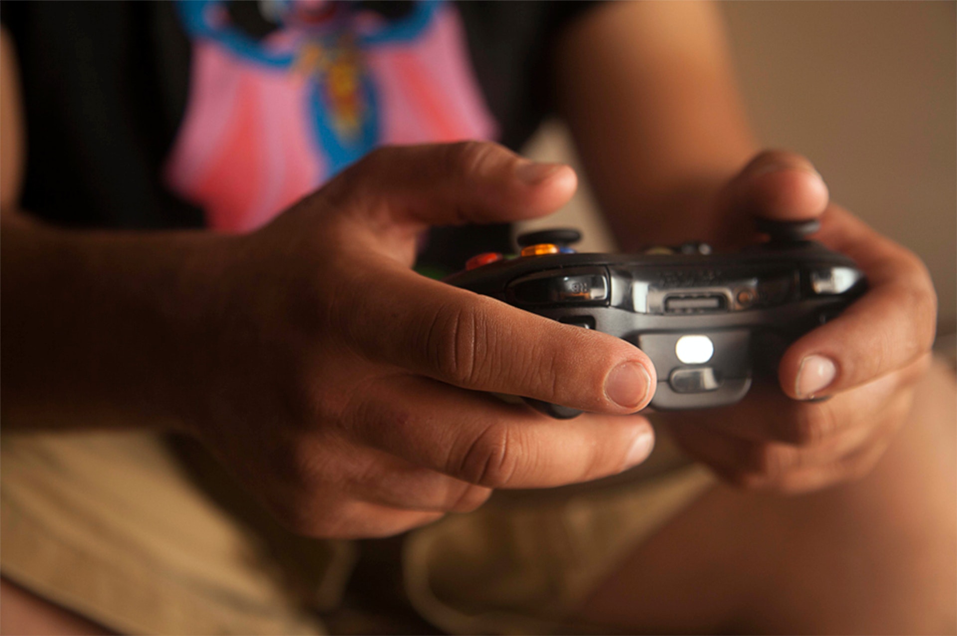 person-holding-black-game-controller